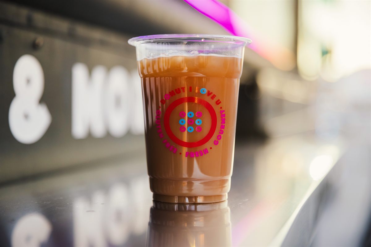 A cold drink in a Donut I Love U cup, on the truck’s counter.